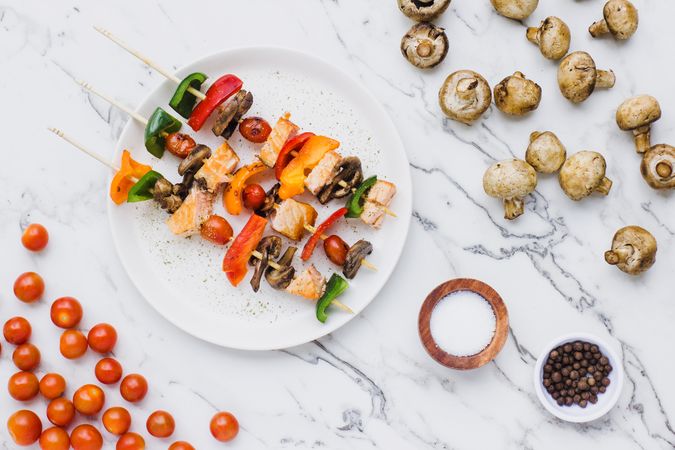 Served salmon cherry tomatoes mushrooms and peppers