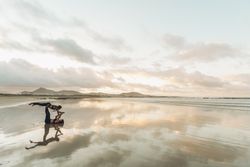 Women exercising near sea