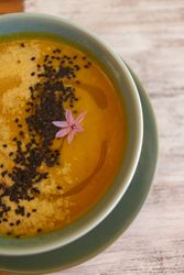 Tasty soup puree with seeds in bowl