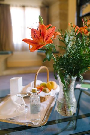 Bouquet and tray on table in hotel room