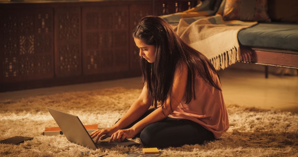 Focused Indian Woman Studying at Home: Engaged in Learning, Researching, Study Remotely for University Degree