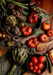 Assorted vegetables and napkins on table