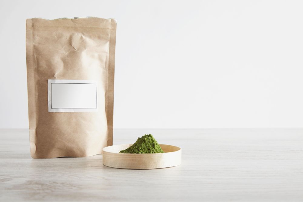 Matcha tea powder in brown bag