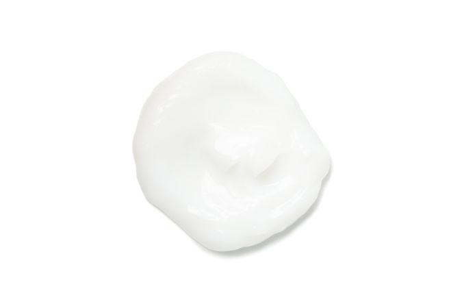 Cream spot isolated on blank background. Cosmetics. Hygiene