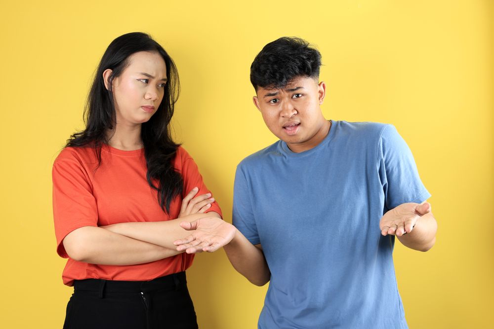 Young Asian Couple, the Woman Angry While the Man Nothing Idea
