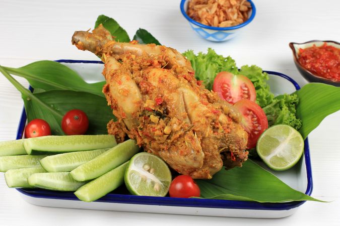 Roast chicken on bed of vegetables