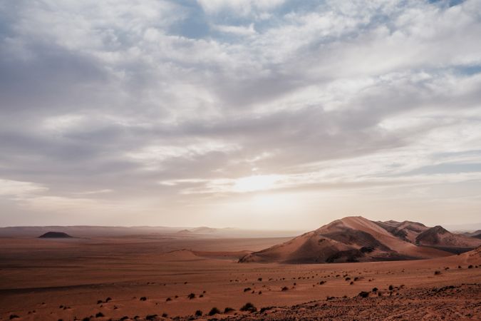Sunset sky over hills in desert