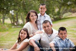 Happy Hispanic Family In the Park 4NEnal