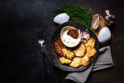 Traditional Ukrainian dish deruny on dark counter