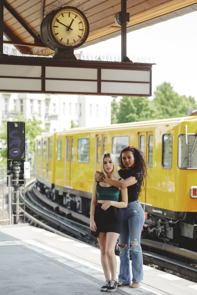 Friends standing on train platform