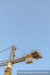 Yellow crane under blue sky bGJVl4