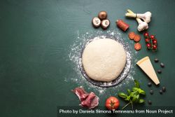 Pizza ingredients and raw dough on table 0Jl7N4