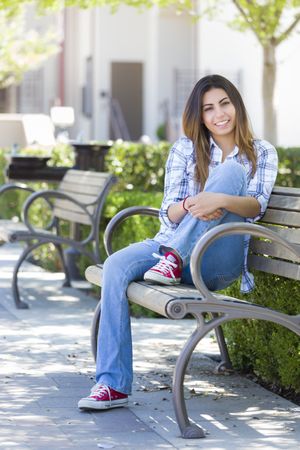 Female Student on School Campus Bench