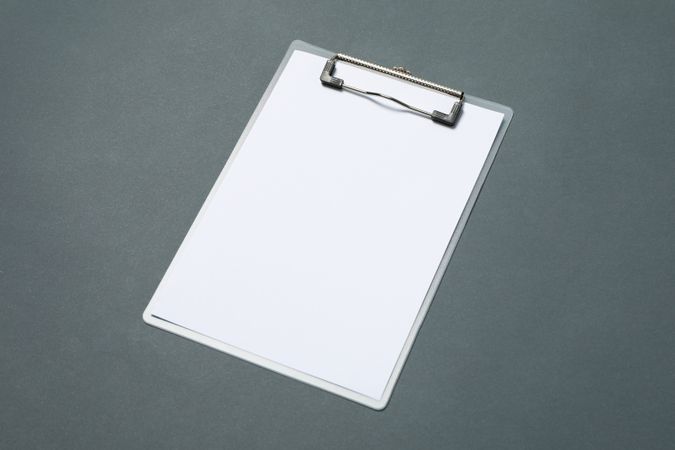 Empty clipboard on light dark background, space for text