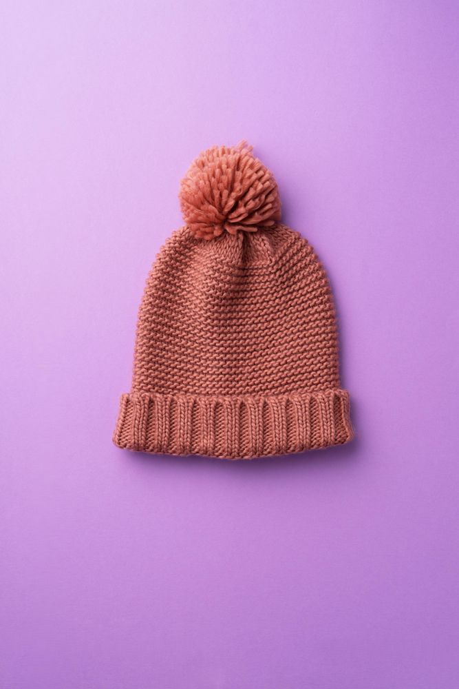Knit beanie on purple background