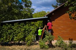 Mature couple working on their house.