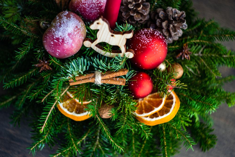 Christmas centerpiece with dried oranges and reindeer decorations