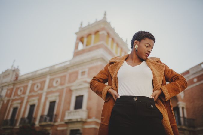 Stylish Black woman with handbag on street