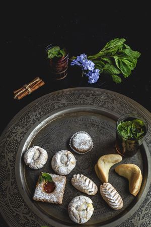 Traditional tea with mint and assorted Arab sweets