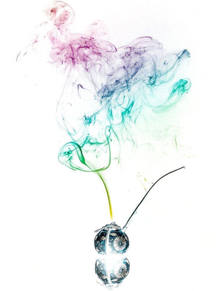 Jar with herbs emitting smoke