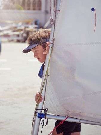 Young boy with sail of boat
