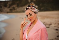Stylish female resting on seashore
