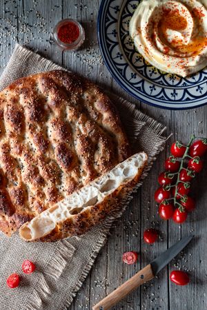 Ramazan pidesi near spices and tomatoes