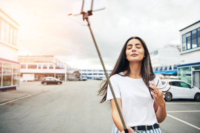 Woman closing her eyes posing for selfie