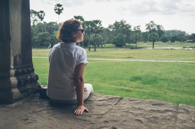 Female tourist looking at old temple