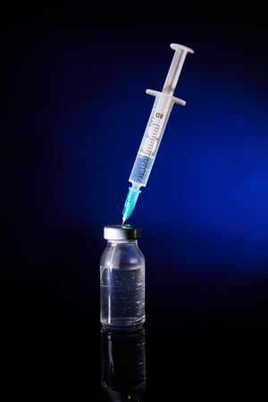Medical injection with vaccine in studio