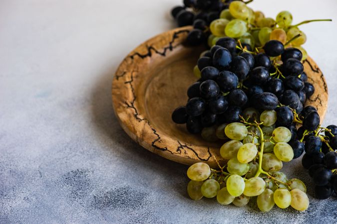 Grapes on rustic plate