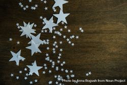 Star decorations scattered on wooden table with copy space 4m8we5