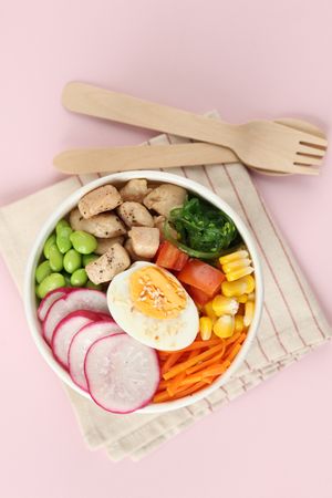 Top View Tasty Take Out Poke Bowls Isolated on Pink Background