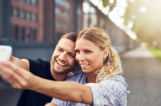 Couple smiling while taking selfie
