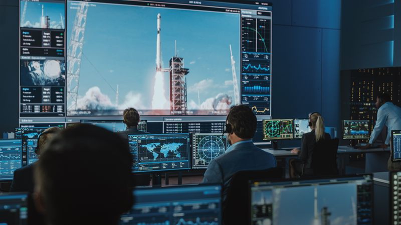 Space Mission Control Room Monitors Rocket Launch.