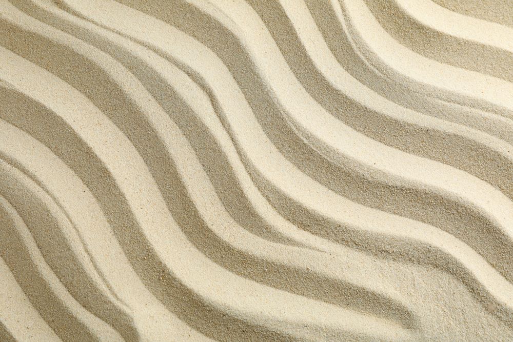 Seamless sand on a whole background, space for text. Summer vacation backdrop