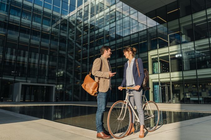 Businesspeople talking on street after work