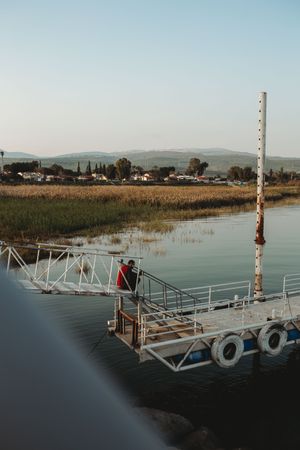 Tourist walking on shabby pier