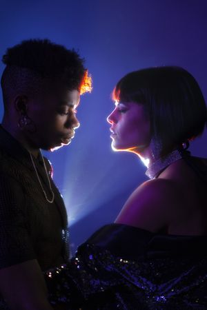 Traces of light on faces of couple