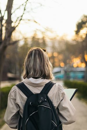 Back view portrait of a female student blonde