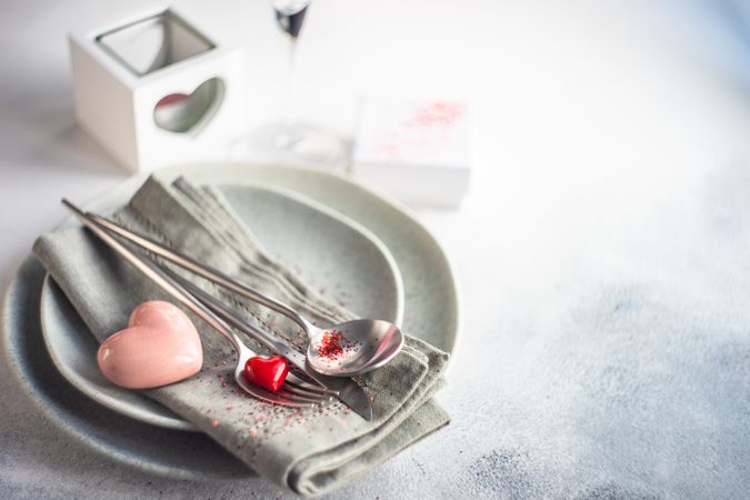 Grey table setting for Valentine's day with pink and red heart