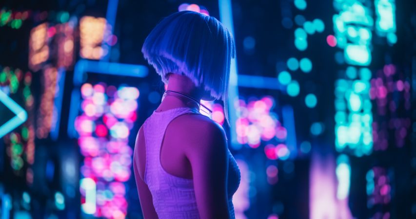 Beautiful Retro-Futuristic Portrait of a Human Gamer Girl Resembling an Android Robot with Artificial Intelligence, Travelling in Modern City with Neon Lights and Colorful Cyberpunk Vibe