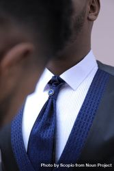 Two Black men in suits in close-up bDmNK0