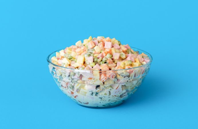 Mayonnaise salad bowl isolated on a blue background