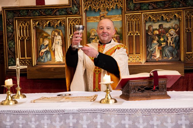 Vicar at altar