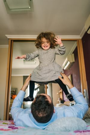 Father playing with daughter