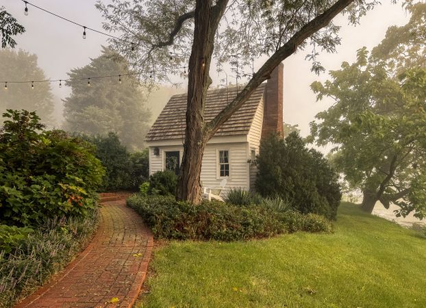 A writers cottage in morning mist