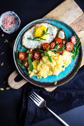 Top view of healthy breakfast plate on wooden board