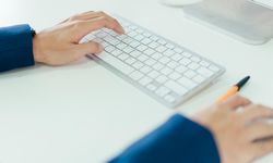 Hands with bright computer keyboard