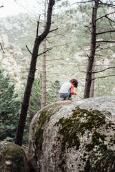 Boy walking on rocky hill